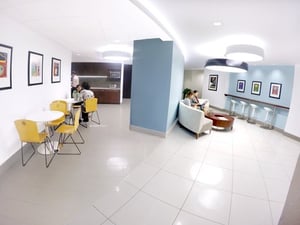 Office space with couch and table with chairs