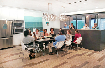 Open are office space with conference room and high desk.
