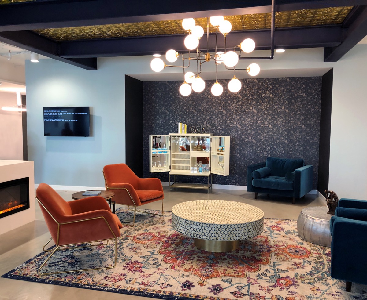 Open office space with round table and chairs.