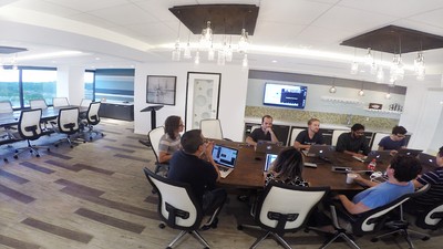 Conference room with large table and chairs.