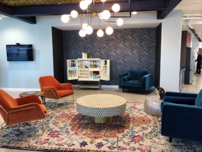 Open office area with four chairs facing each other.