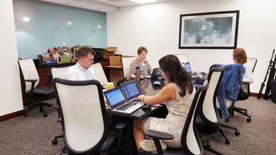 Group of colleagues working at a conference table.