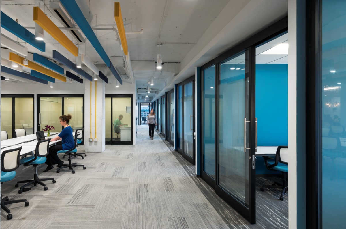 Open office space with desks, and some private offices.